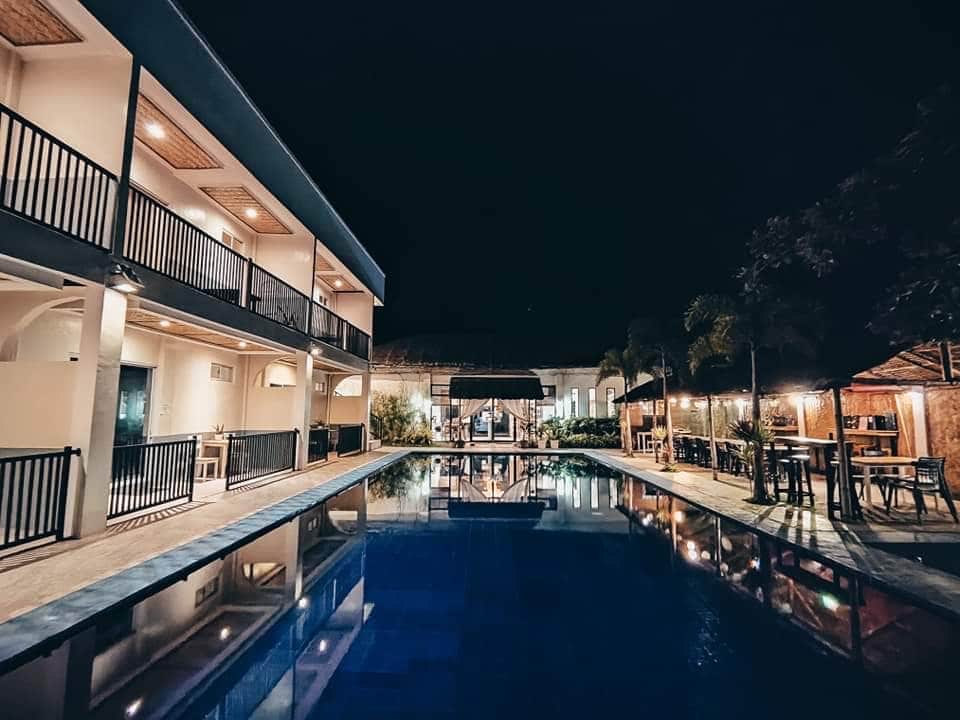 Night view of the resort pool and bar area